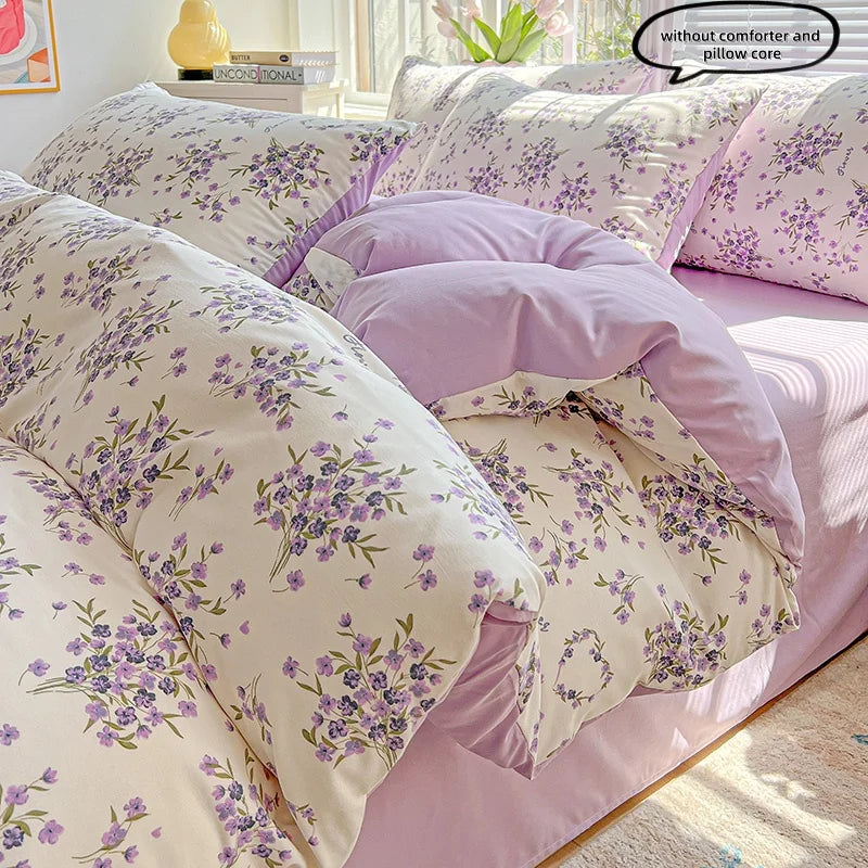 Lavender floral duvet cover set featuring purple and green floral patterns on a pink background