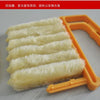 A yellow dusting brush with multiple white fibers is shown next to the product.