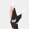 A hand wearing black waterproof LED half-finger gloves with an adjustable strap, demonstrating light emission.