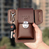 A brown PU leather waist bag with a flap and key chain is held in a hand.
