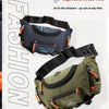 A dark blue tactical chest bag with an orange strap and pocket visible against a white background.