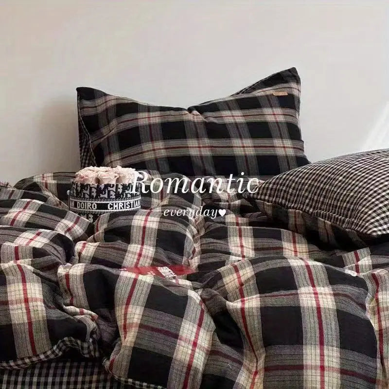 Black and red plaid bedding set featuring a duvet cover, flat sheet, and pillowcases.
