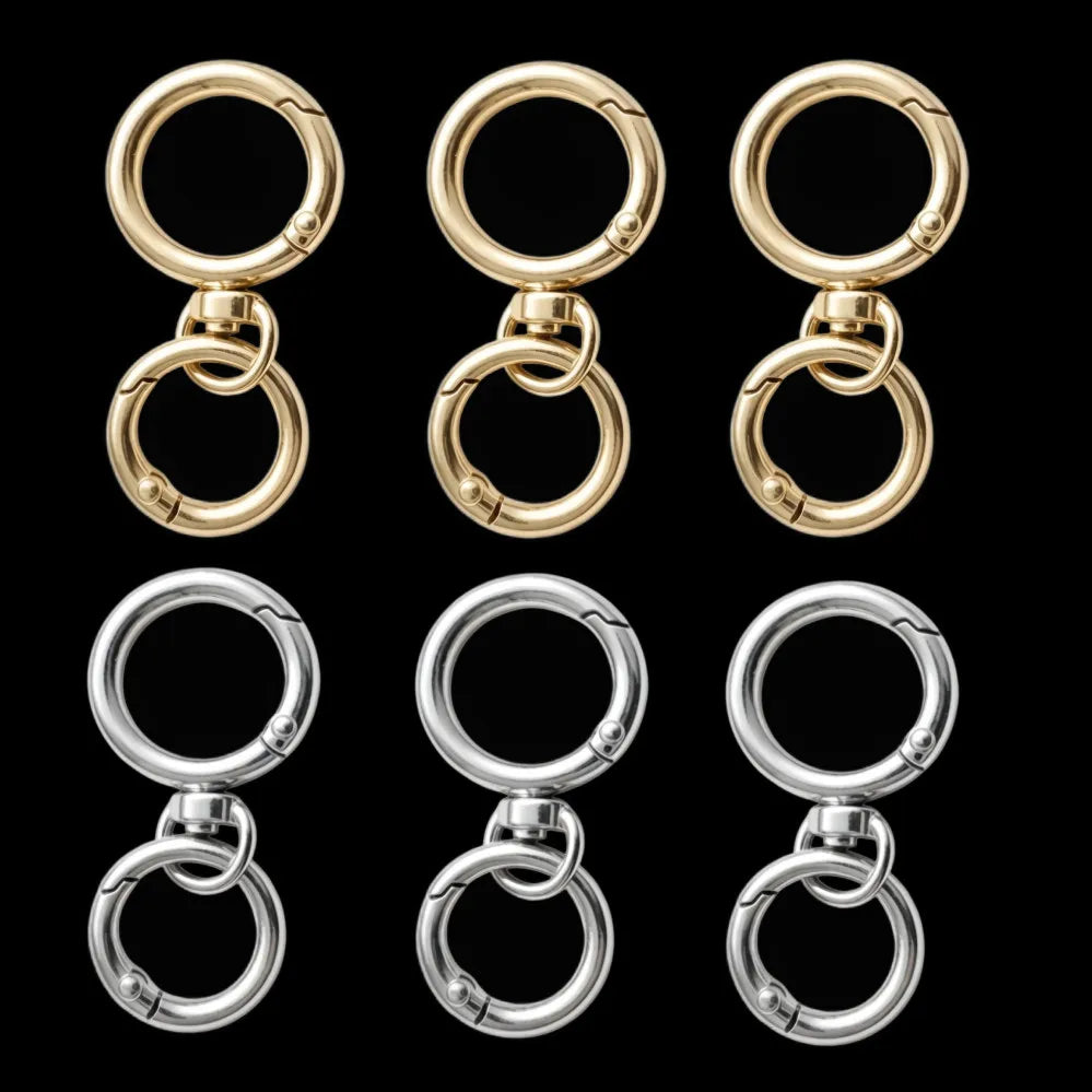 A set of round gold spring snap hooks and carabiners in zinc alloy for bags, keychains, and crafts.
