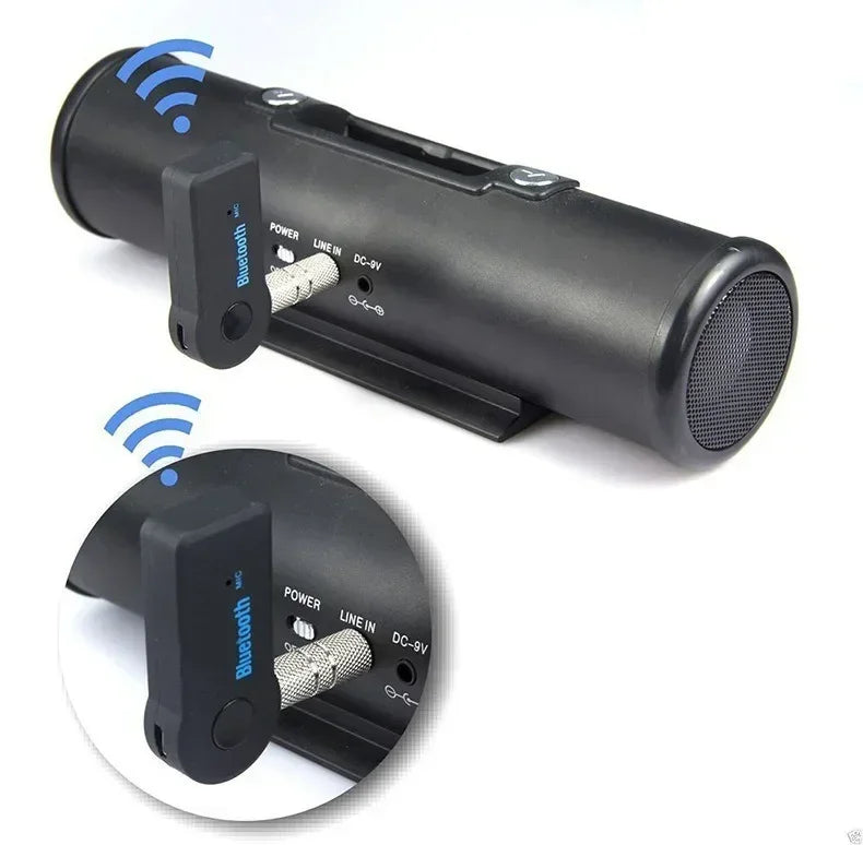A black Bluetooth audio receiver unit with a 3.5mm AUX adapter, shown alongside a mounting plate.
