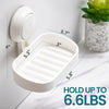 A white suction cup soap dish holder with a removable tray is shown mounted on a wall, demonstrating its dimensions.