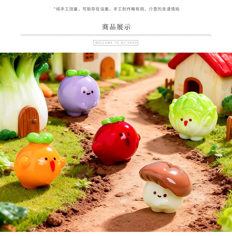 A collection of hand-painted resin vegetable figurines, including a purple eggplant, red tomato, yellow carrot, and green cuc