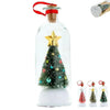 A clear glass bottle shaped like a Christmas tree with gold star topper and snowy scene inside