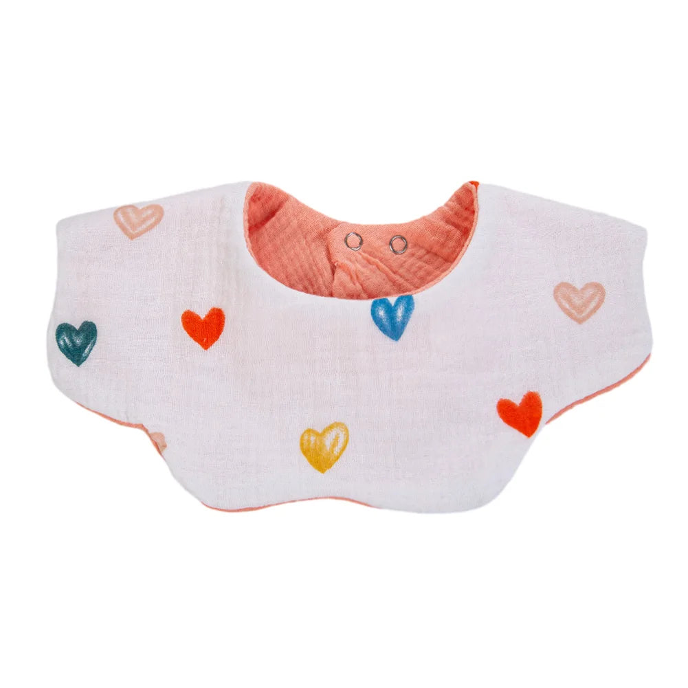 A white muslin cotton baby bib with a pink trim and small colored heart embroidery.