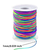 A spool of 1mm elastic stretchy cord in various bright colors for jewelry making