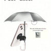 A silver UV-blocking phone sunshade with an adjustable suction cup stand is shown above a smartphone.