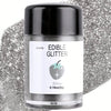 A glass jar of silver edible glitter powder labeled Silver 0.18oz for baking and dessert decoration