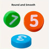 Three round arithmetic block cards showing the numbers 7, 5, and 3 in green, orange, and blue.