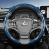 A black steering wheel with blue carbon fiber texture accents and controls in a car interior.