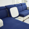A deep blue Jacquard stretch sofa slipcover with white accents and non-slip grip.