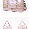 A pink iridescent travel duffel bag with handles and zipper, shown from the front.