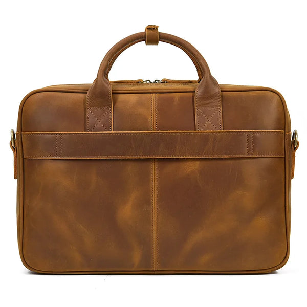 A brown vintage genuine leather executive laptop briefcase with leather handles and a zipper.