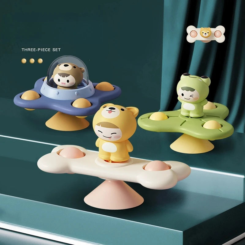 A three-piece set of spinning bath toys for toddlers featuring various colored water wheels and floating animal figures.