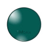 A round, dark teal glass photo cabochon for jewelry making.