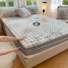 A luxury faux fur fitted sheet and pillowcase set displayed on a bed, with a hand touching the fabric.