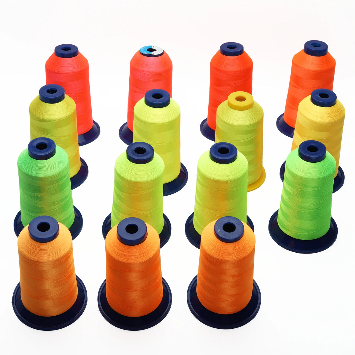 A collection of multi-colored polyester embroidery threads in various shades of orange, yellow, and green spools.