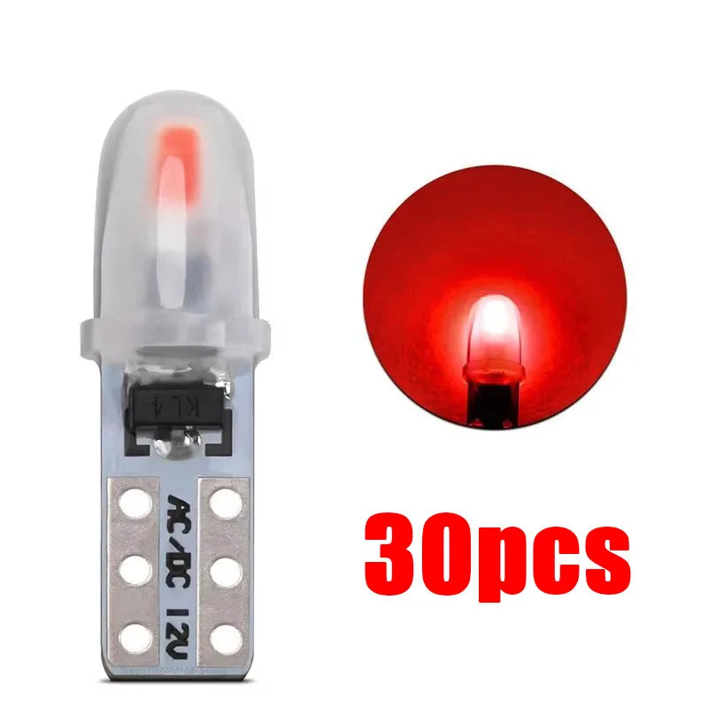 A single T5 wedge LED bulb with a clear glass envelope and silver base is shown next to a red glowing light source.