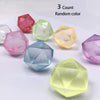 A set of four colorful, translucent stress cubes or fidget toys displayed on a white surface.