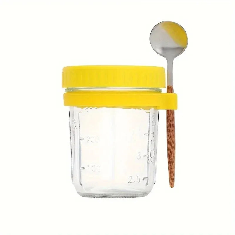 A clear glass jar with a yellow lid and a wooden spoon is shown for overnight oats.