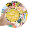 A hand holds up an inspirational Bible verse sticker pack featuring various Christian decals and colorful designs.