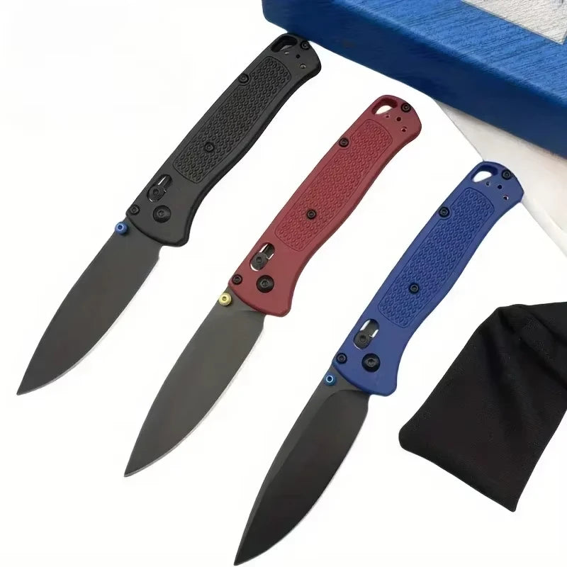 A compact folding knife with a black blade and various colored nylon fiber handles is shown.