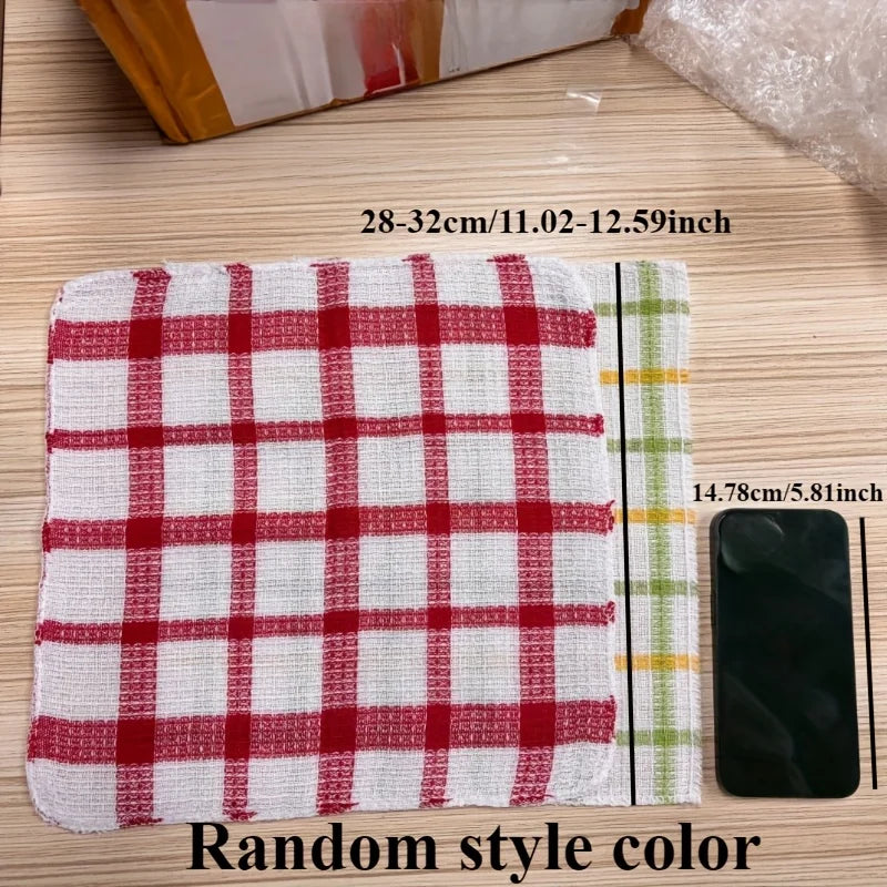 A red and white plaid kitchen towel is shown next to a green striped towel and a smartphone.