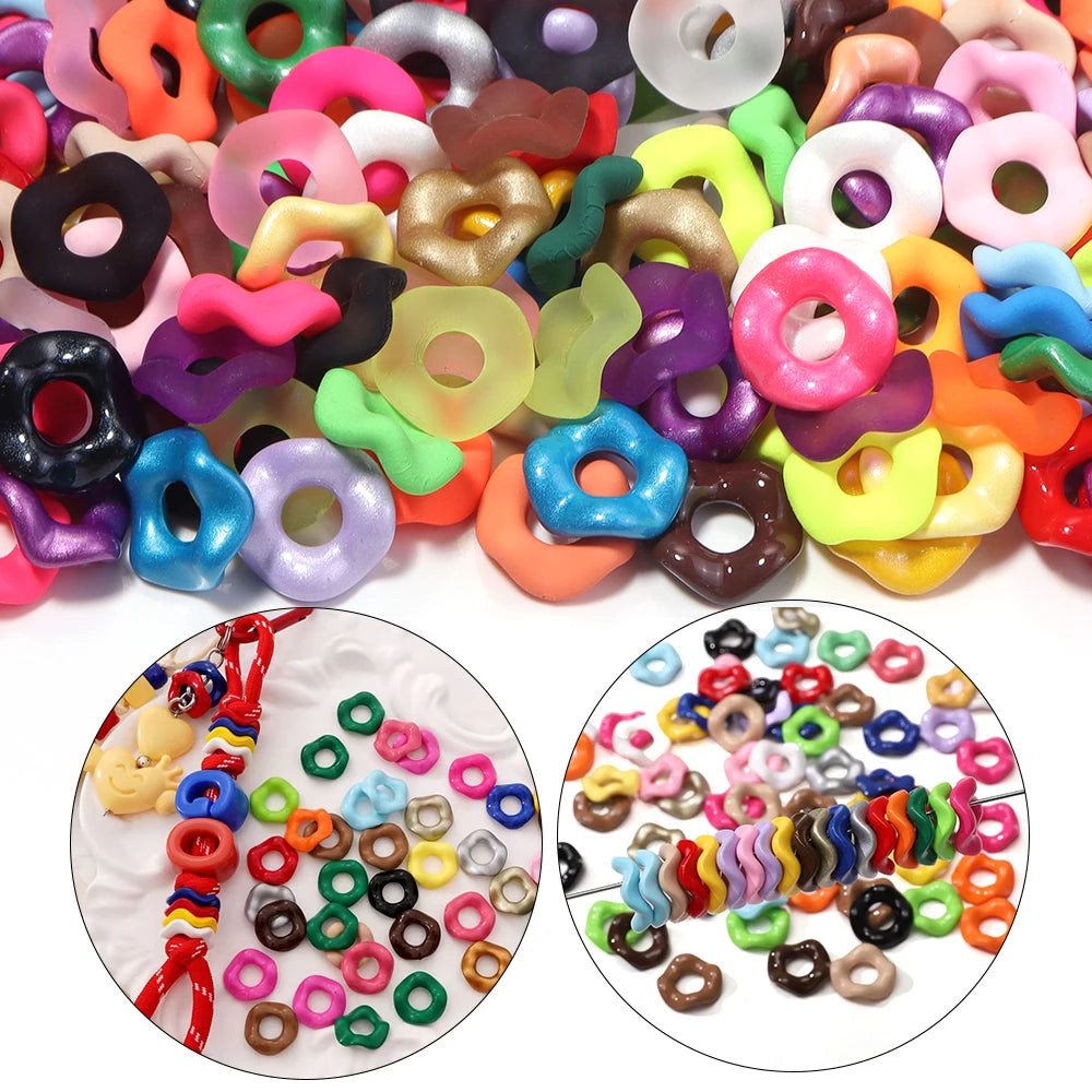 A variety of colorful acrylic spacer beads in wave patterns and various shapes are displayed for jewelry making.