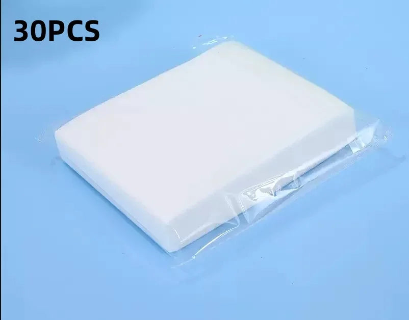 A white laundry color absorbing paper sheet packaged in clear plastic, shown against a light blue background.