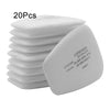 A stack of white replacement dust filter pads for respirators, showing the mask side.