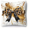 A decorative pillowcase featuring a leopard print bow design with gold and brown watercolor splashes on a white background.