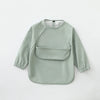 A light sage green waterproof long-sleeve smock for toddlers.