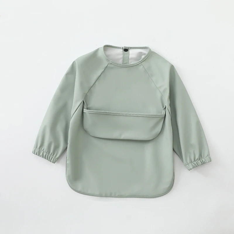 A light sage green waterproof long-sleeve smock for toddlers.