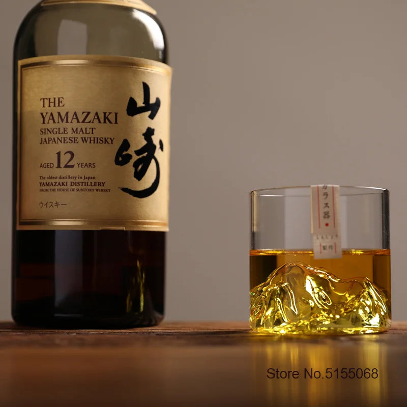 A glass of Yamazaki single malt Japanese whisky is shown next to a bottle label.