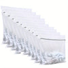 A stack of clear mesh laundry bags filled with white fabric, arranged in a row.