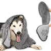A fluffy gray pet bath towel is draped over a dog's head, showing its soft texture and absorbent material.