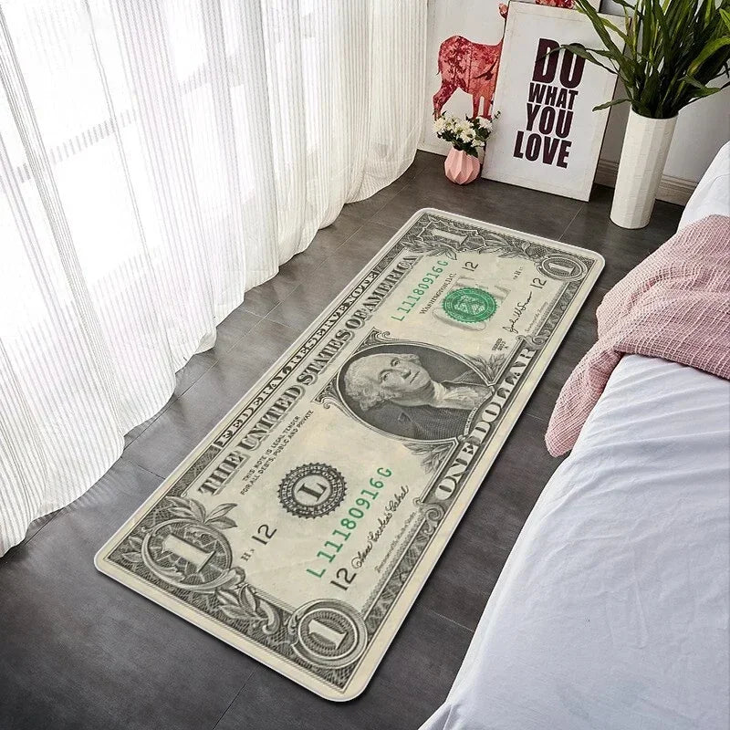 A rectangular banknote pattern anti-slip soft floor mat placed on a gray floor next to a bed.