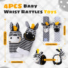 Four pieces of baby wrist rattles and foot finder socks for newborns shown in various patterns.