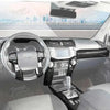 Interior view of a Toyota 4Runner showing the steering wheel and dashboard with carbon fiber trim.