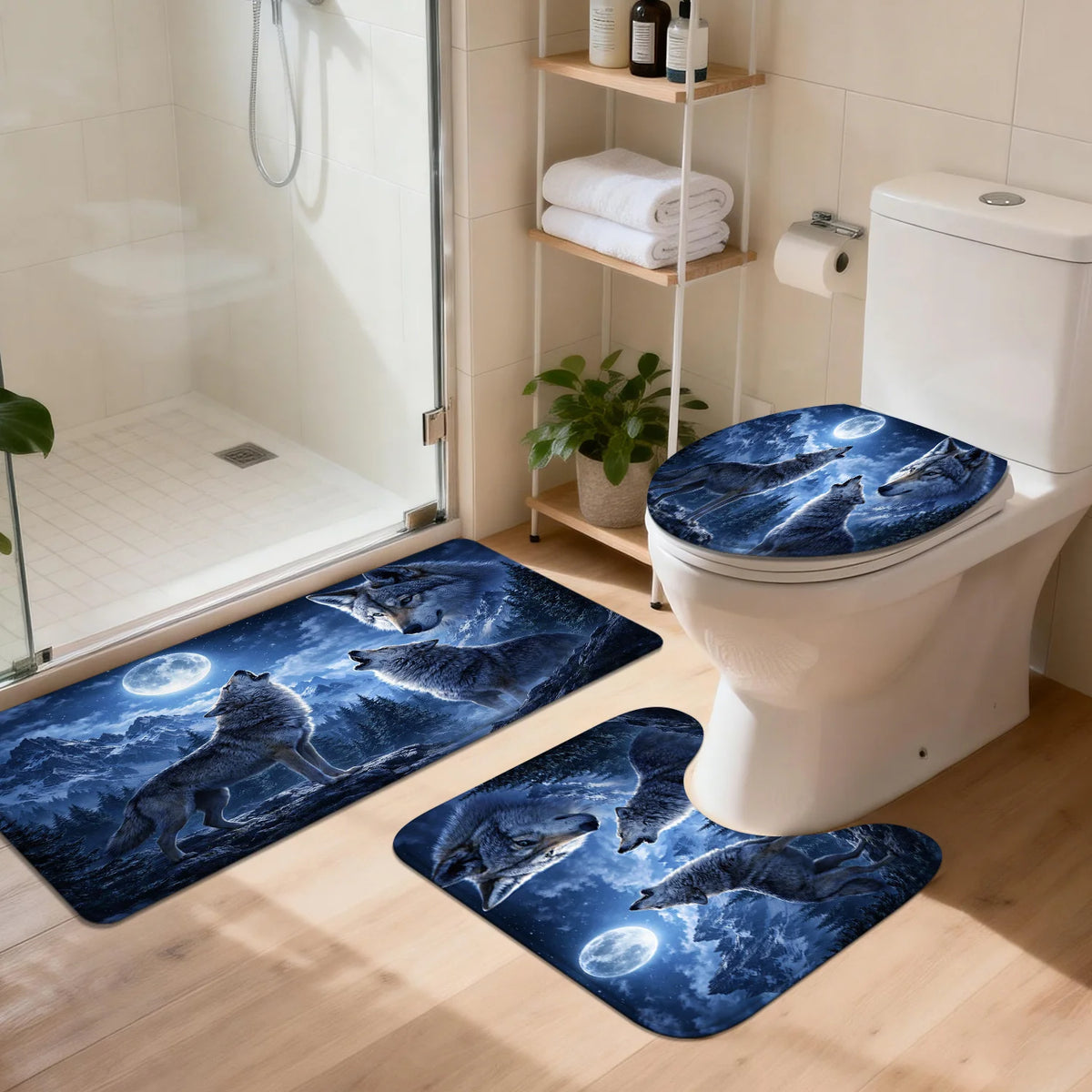 A set of three blue and white wolf designs non-slip bathroom mats placed in front of a white toilet.