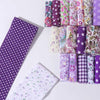 A collection of 40 floral cotton fabric strips in various patterns and colors for quilting and patchwork