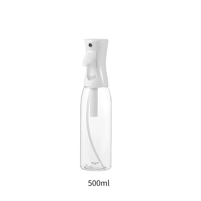 A clear, refillable fine mist continuous spray bottle with a pump dispenser.