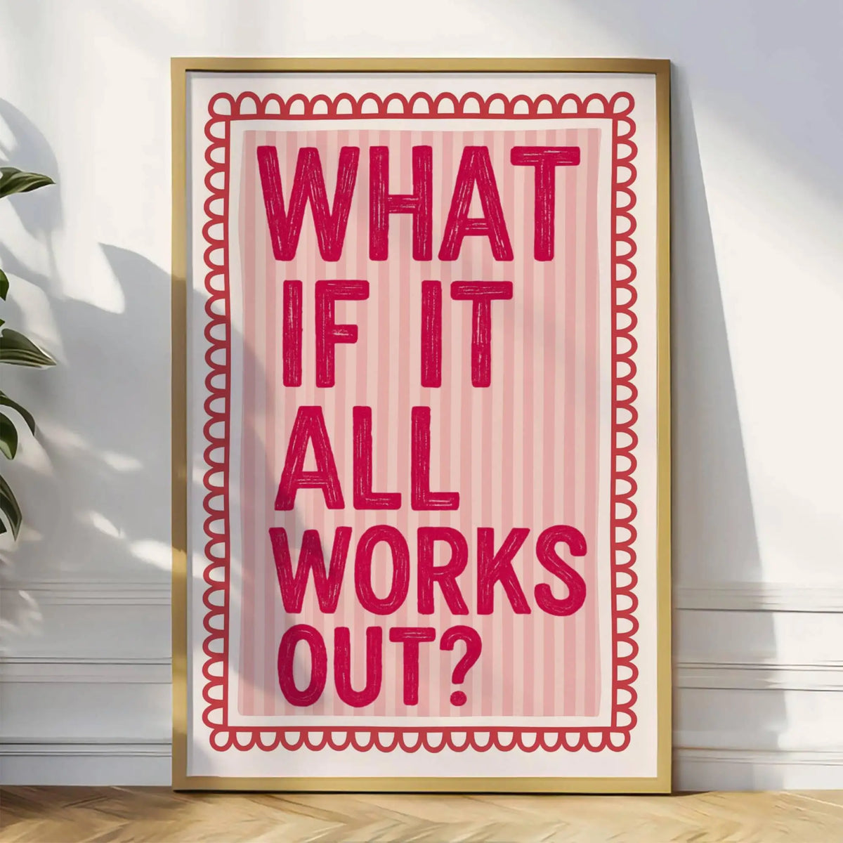 A framed canvas print featuring the text What if it all works out? in a pink and white striped retro newspaper style.