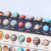 A collection of wooden solar system puzzle spheres representing planets like Mercury, Venus, Earth, Mars, Jupiter, Saturn, Ur