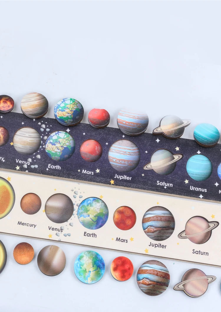 A collection of wooden solar system puzzle spheres representing planets like Mercury, Venus, Earth, Mars, Jupiter, Saturn, Ur