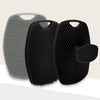 A set of two silicone body scrubbers or massage brushes, one silver and one black, shown against a light background.