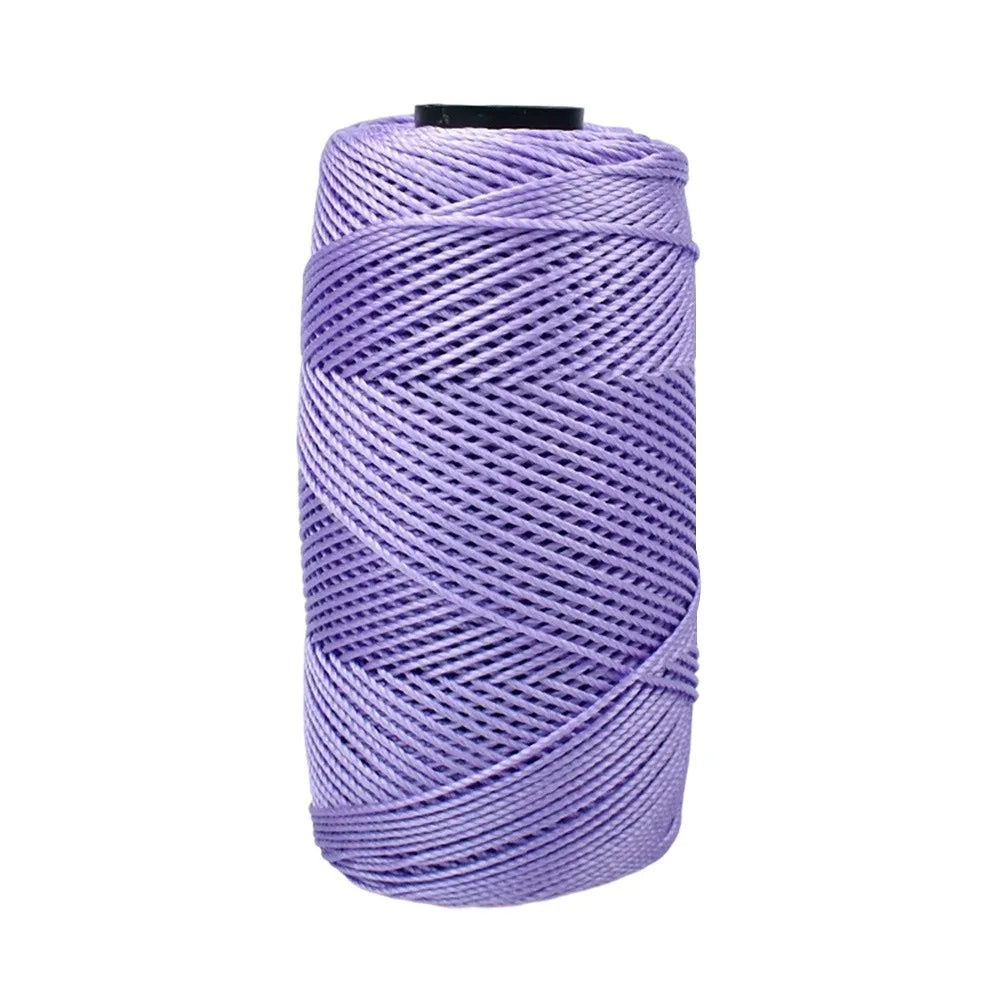 Purple ice cotton silk thread wound tightly on a spool for knitting and crochet